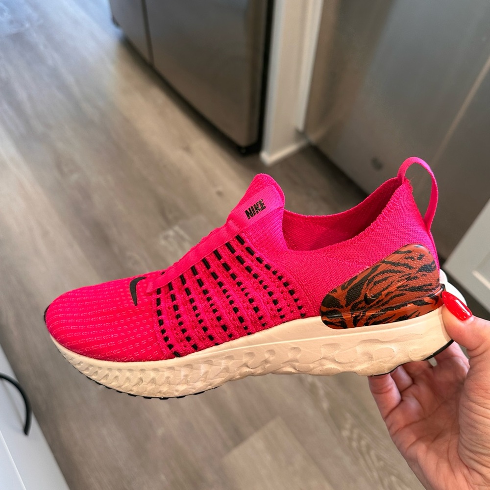 Nike React slip on tennis shoes.  Size 7.5, worn a few times.